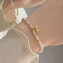 Pulsera Dorada Perlas Flor Lily