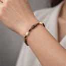 Pulsera de Ojo de Tigre y Perla