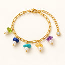 Pulsera dorada con piedras multicolor y perlas