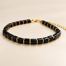 Pulsera de Ónix Negro con Detalles Dorados